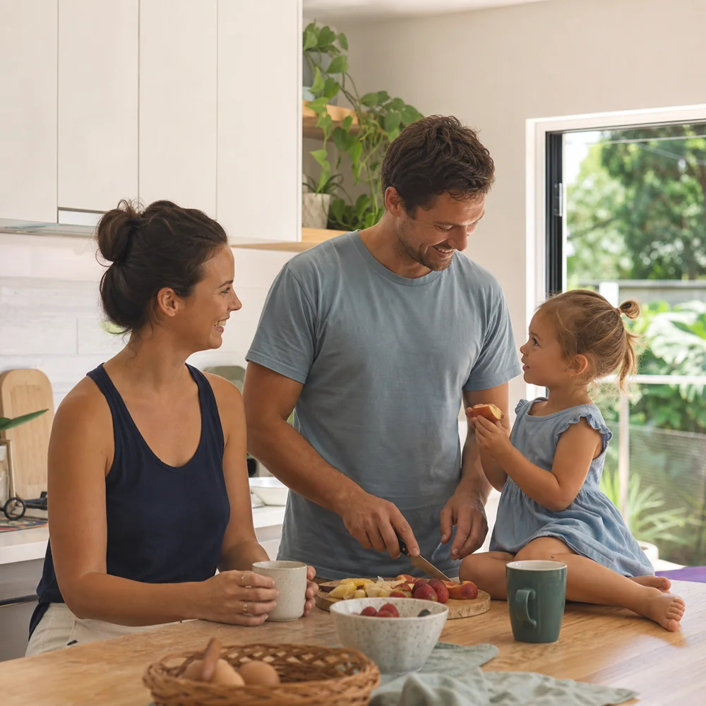A young family sharing breakfast together at home